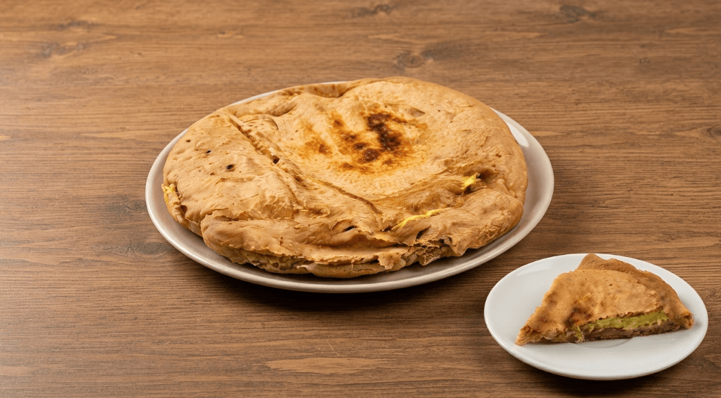 Focaccia integrale al pesto di asparagi e affettato veg