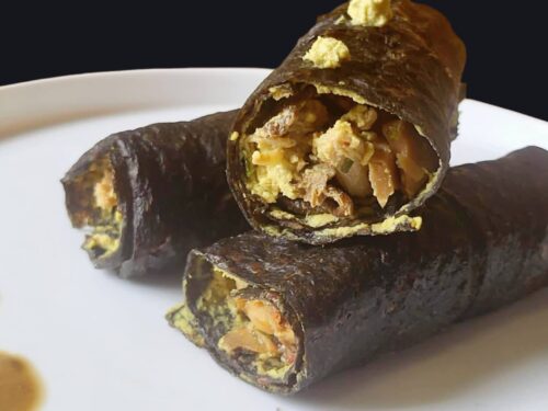 Crespelle crudiste di champignon e zucchine con ragù di porcini, jackfruit e burro di girasole fermentato